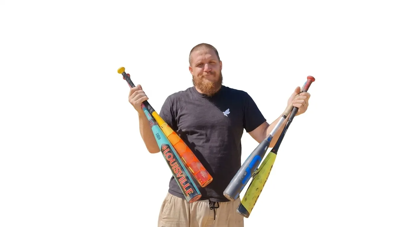 John Gruber holding a bunch of baseball bats